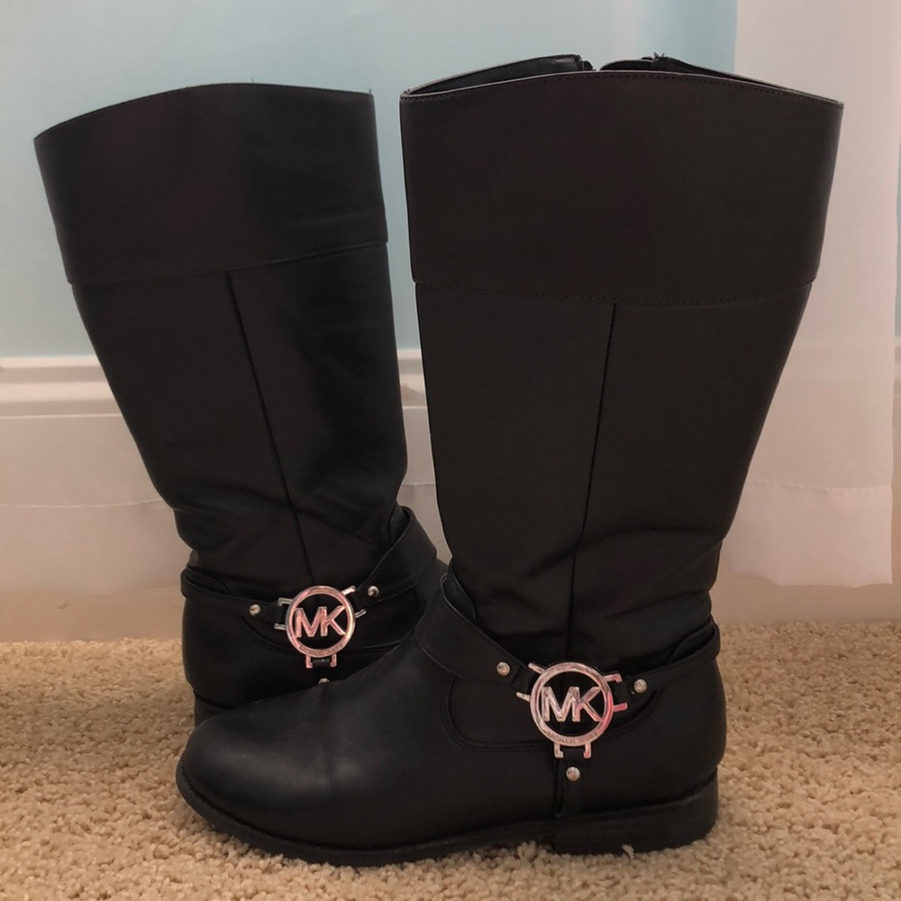 Black and dark brown Micheal Kors boots.